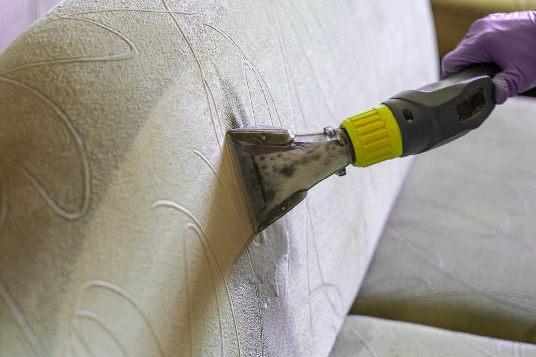 Closeup of upholstered Sofa chemical cleaning